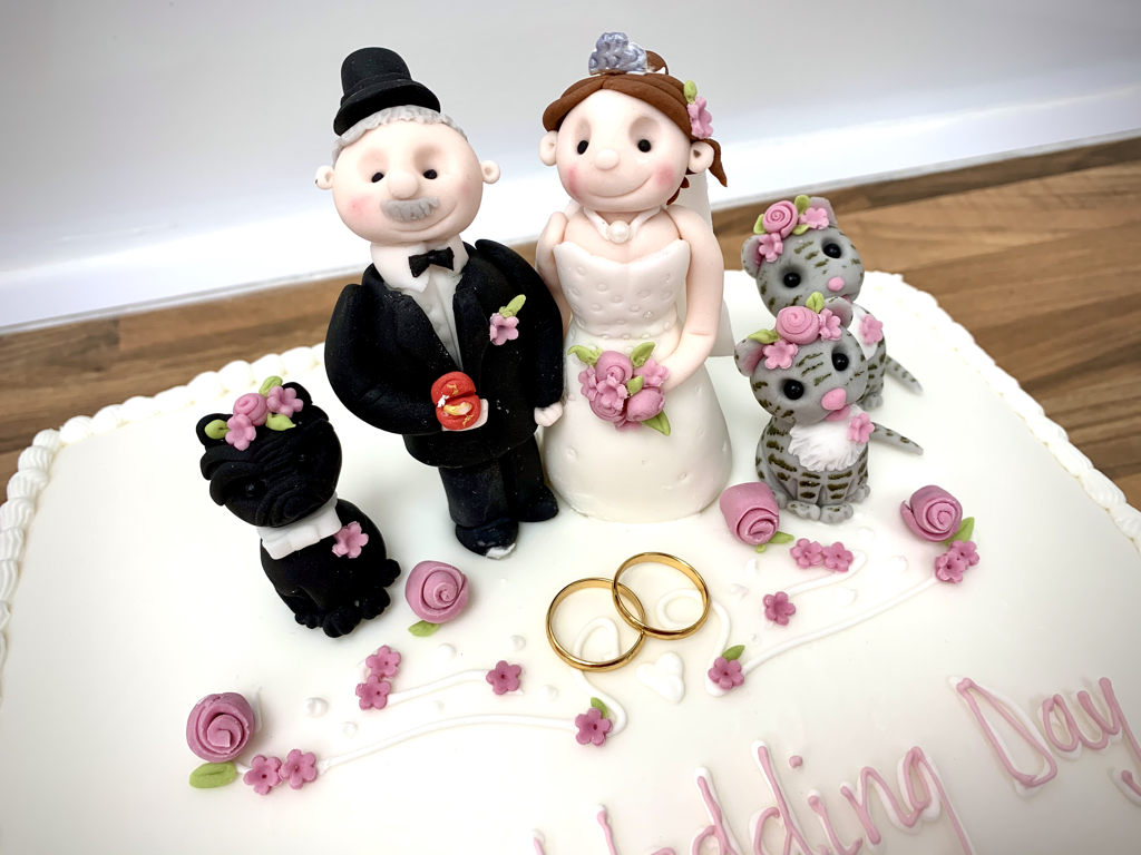 Hand crafted sugar paste models bride and groom dog and cats made at sweet Things coleshill 