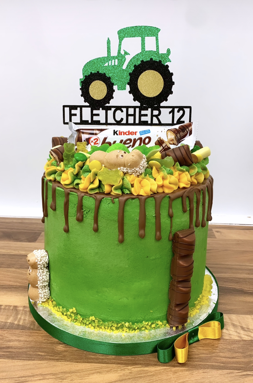 John Deere tractor drip cake with kinder beuno and green and yellow sweets